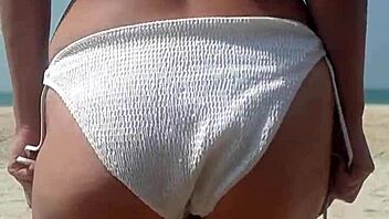 wanna see fat ass peeing in white bikini on beach?