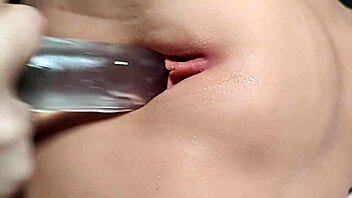 bored cutie fingers her smooth shaved pussy up close