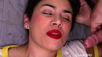 brunette smiles wide as cumshot blasts her face in close-up pov