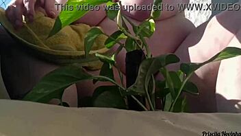 naked tattooed babe waters plants on balcony flashing tits