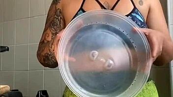 the wife films cooking videos online but really flashes her swollen young pussy