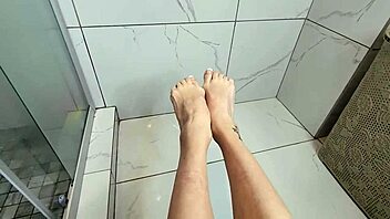 Morning shower footjob milf strokes cock perfectly!