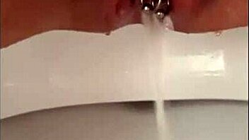 Close-Up Pissing Shaved Pussy Pierced Clit Dripping Wet