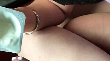 Chinese woman pours yogurt on treat and licks it up in playful Asian scene