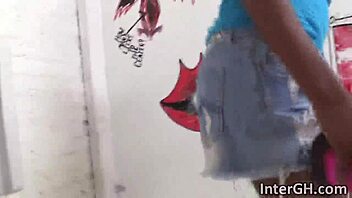Wanna watch this hot ebony babe slobbering on monster big cock through gloryhole?