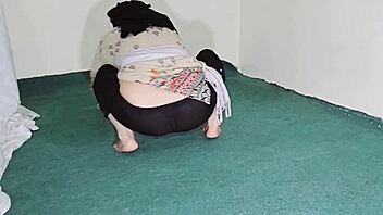 big ass indian maid flaunts curves in sheer black pajamas while cleaning