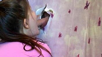 our first homemade gloryhole lets brunette suck cock through walls intensely
