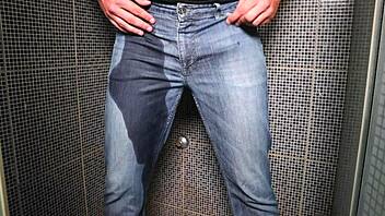 amateur dude soaks jeans peeing then blasts cum publicly
