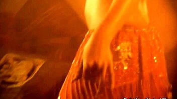 exotic brunette performs sensual striptease dance in glamorous setting