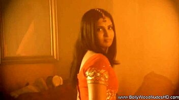 exotic brunette performs sensual striptease dance in glamorous setting