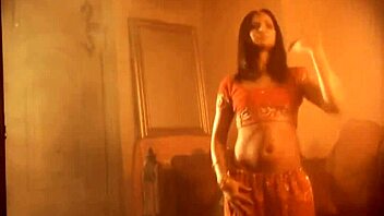 exotic brunette performs sensual striptease dance in glamorous setting