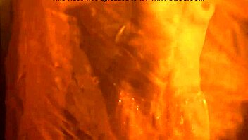 exotic brunette performs sensual striptease dance in glamorous setting