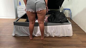 camera catches her arranging trunk in deep emotional surprise