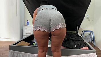 camera catches her arranging trunk in deep emotional surprise