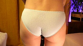 Teasing skinny blonde's panty-covered booty softly