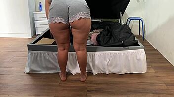 camera catches her arranging trunk in deep emotional surprise