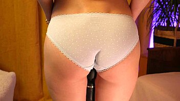 Teasing skinny blonde's panty-covered booty softly