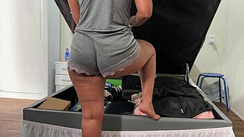 camera catches her arranging trunk in deep emotional surprise