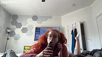 redhead distracts gamer with playful toys during session