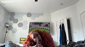redhead distracts gamer with playful toys during session