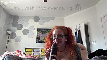 redhead distracts gamer with playful toys during session