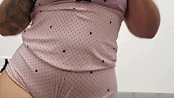 Hot redhead flashes her perky tits and pink pussy