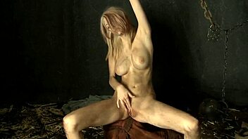 Chained Cosplay Babe Masturbates Shaved Pussy in Bondage