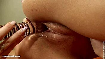 suzi and winona share dildos in close play