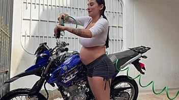 oh man i'm all pregnant washing this bike then he fucks my wet pussy cowgirl style outdoors ugh!