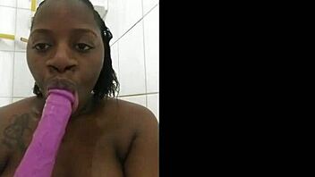 naejae's ebony milf body glistens as she sensually sucks dildo in steamy shower 💦🛁