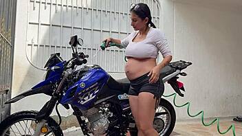 oh man i'm all pregnant washing this bike then he fucks my wet pussy cowgirl style outdoors ugh!