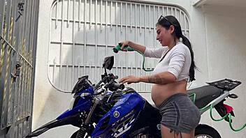 oh man i'm all pregnant washing this bike then he fucks my wet pussy cowgirl style outdoors ugh!