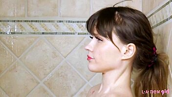 charming blonde steps into steamy hot shower