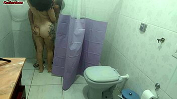 puts up bathroom curtain to watch curvy milf lick big cock