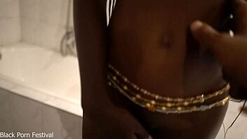 Dolcina seductively showers her skinny African tits and curves
