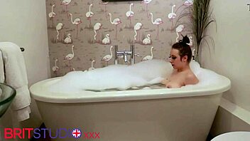 naughty british teen teases with dildo in steamy bath