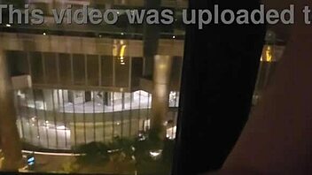hot milf fingers clit close-up masturbating publicly by hotel window