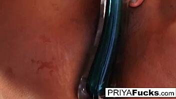 i'm priya the busty milf goddess riding my giant glass toy