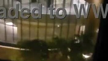 hot milf fingers clit close-up masturbating publicly by hotel window