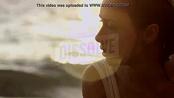 blonde russian teases wet nipples through see-through bra on beach