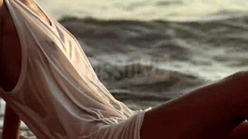 blonde russian teases wet nipples through see-through bra on beach