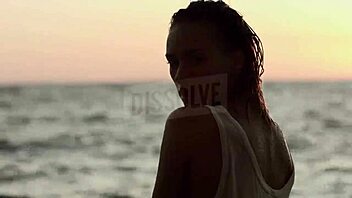 blonde russian teases wet nipples through see-through bra on beach