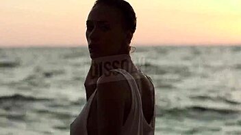 blonde russian teases wet nipples through see-through bra on beach