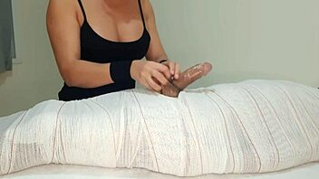 Mummified handjob erupts in quick cum interruption