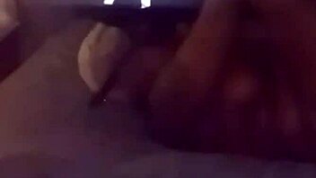 masked lover spreads wide with bar spreader from her fetish shop