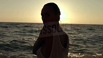 blonde russian teases wet nipples through see-through bra on beach