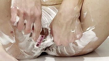 Super Hot Blonde Babe Shaves Smooth Cunt in Shower