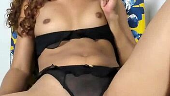Pretty teen babe masturbates sensually on sofa