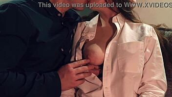 couple kisses necks and licks nipples in bedroom foreplay