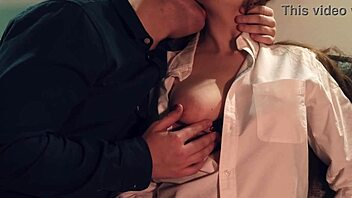 couple kisses necks and licks nipples in bedroom foreplay